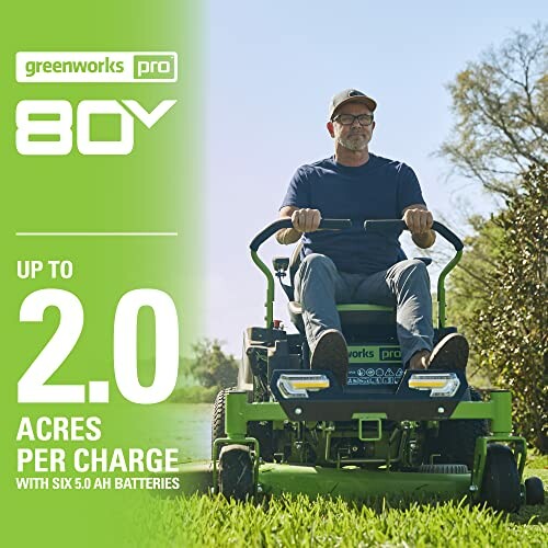 Person using Greenworks Pro 80V lawn mower on grass