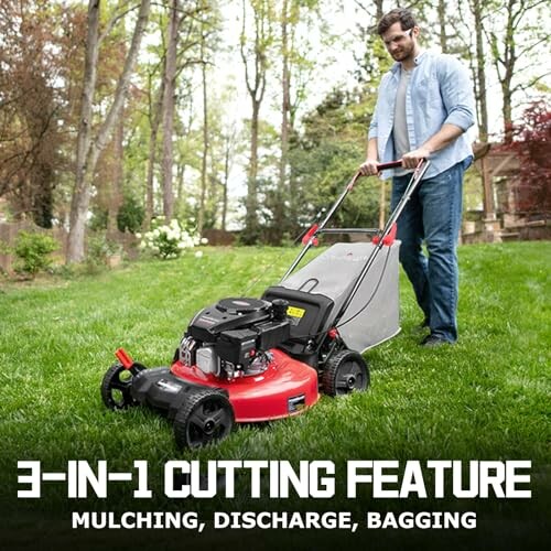 Man mowing lawn with a red 3-in-1 lawn mower.