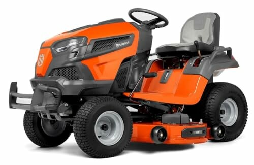 Orange riding lawn mower on white background