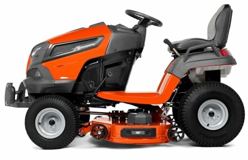 Orange riding lawn mower side view