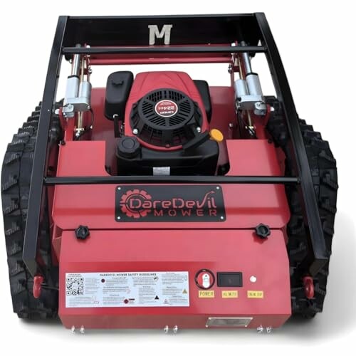 Red remote-controlled lawn mower with tracks and motor