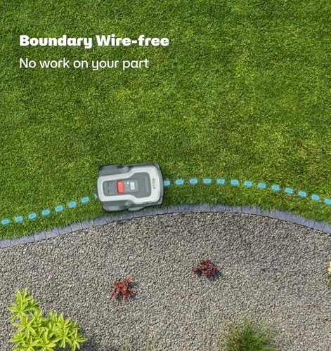 Robot lawn mower operating on grass near a boundary